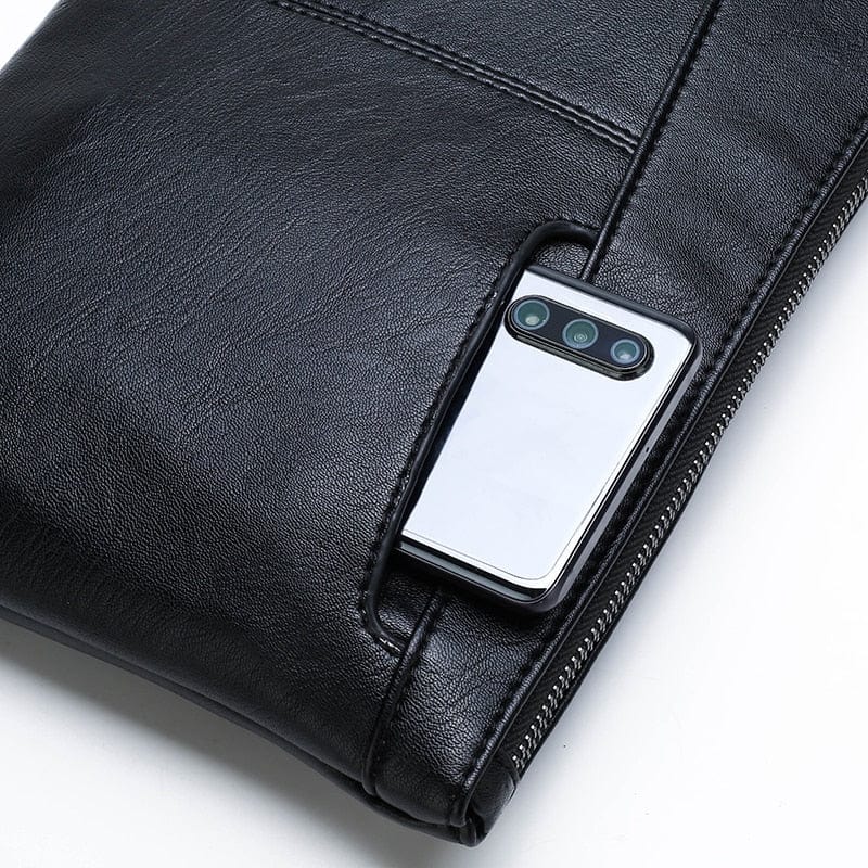 Best Selling Leather Pouch Case Bag for Men and Women. This handmade luxury design brand leather pouch is the perfect solution for business and travel use. The pouch is made from 100% real leather, providing a high-quality and durable solution for your mobile, iPad, and MacBook.